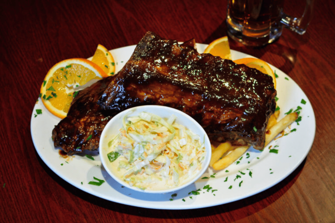 Smoked barbecue ribs served with sauce